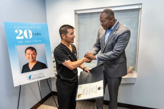 Columbia Aesthetic Plastic Surgery ribbon cutting. Calvin Ball and Dr Chang shaking hands.